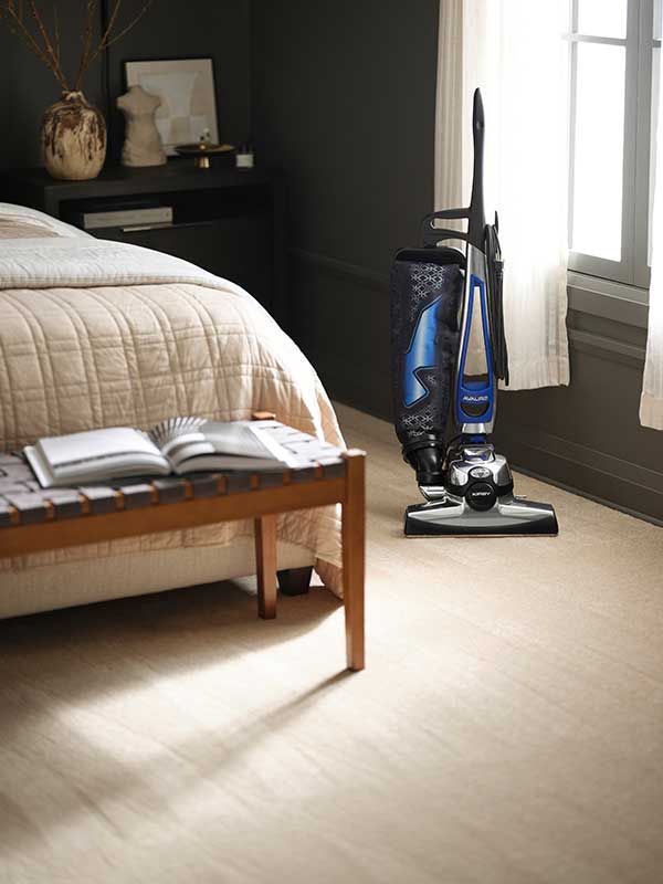 Clean bedroom after vacuuming with Kirby vacuum cleaner.