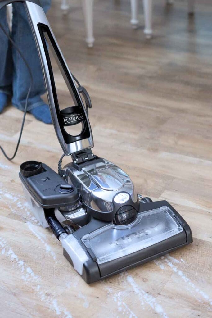 Kirby vacuum cleaner in silver and black, upright model with a sleek design.